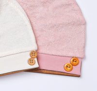 pack of 2 newborn hats with tie and buttons pink and beige